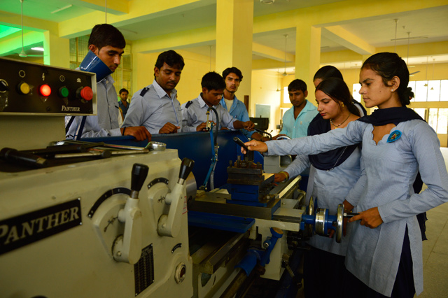 Students of wiremen trade concentrating on practical at ITI Olpad Adopted by NTPC Anta.